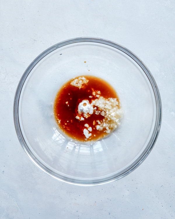 Ingredients for cashew chicken in a glass bowl.