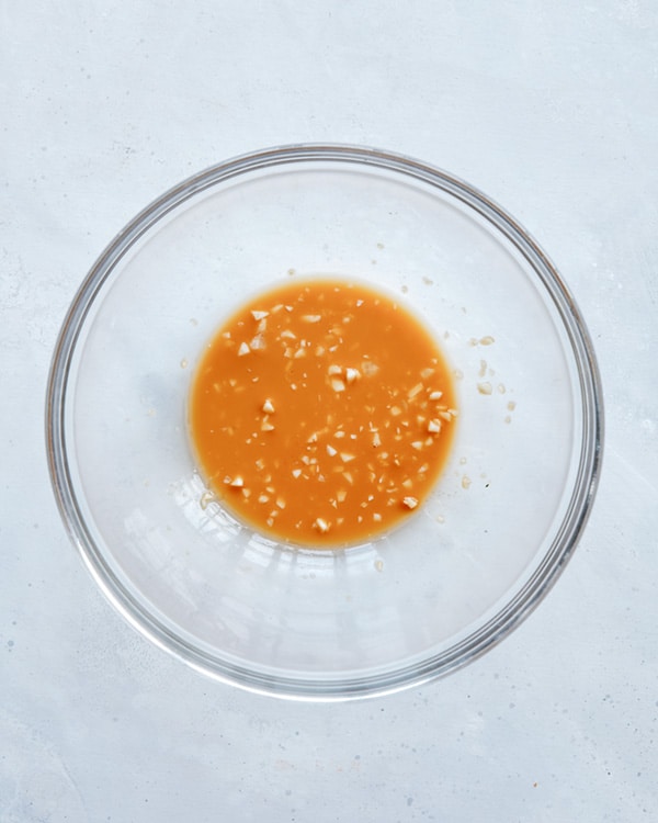 Cashew chicken marinade in a glass bowl.