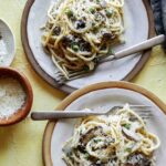 Chicken tetrazzini on two plates.