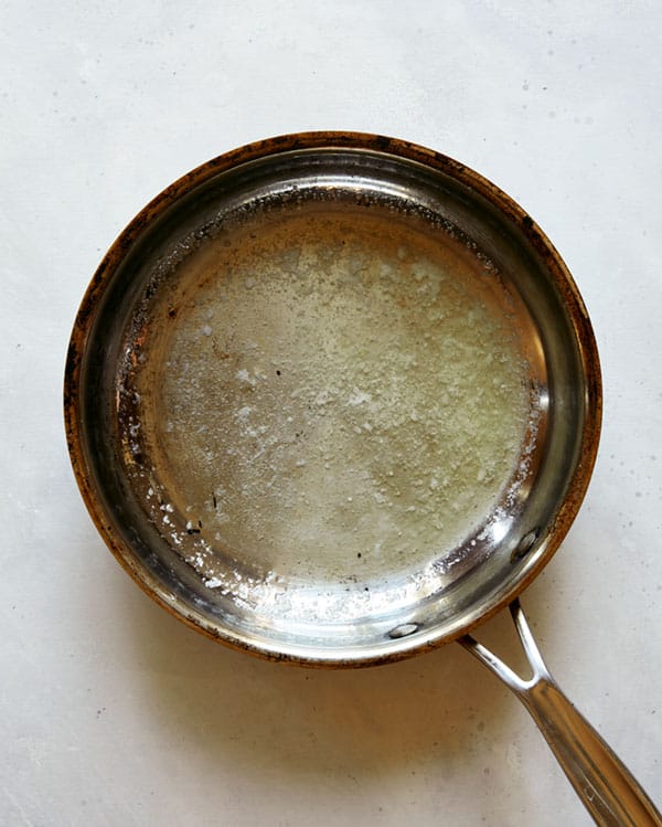 Melted butter in a skillet.