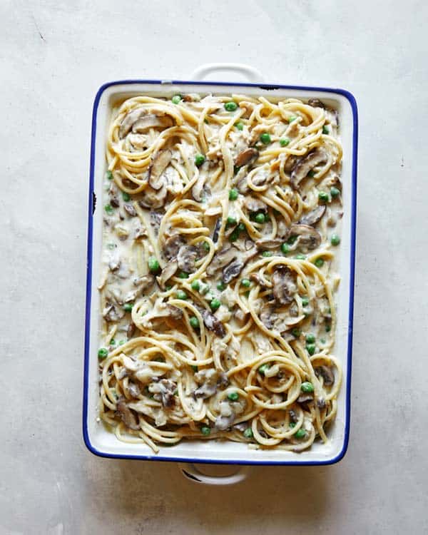 Chicken tetrazzini in a baking dish ready to be baked.