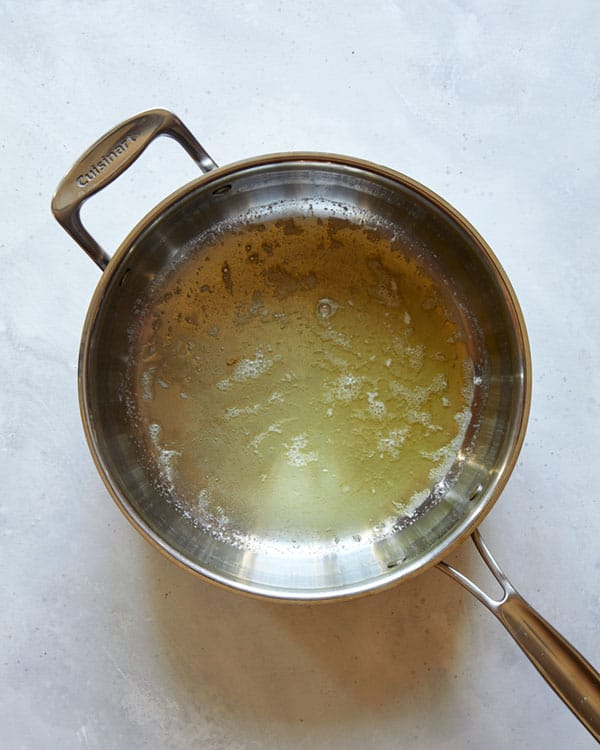 Melted butter in a skillet.