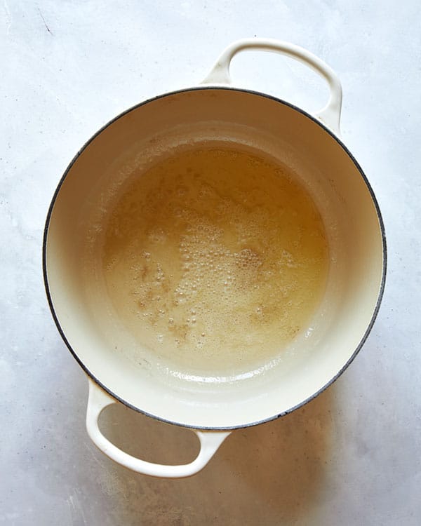 Melted butter in a stock pot.