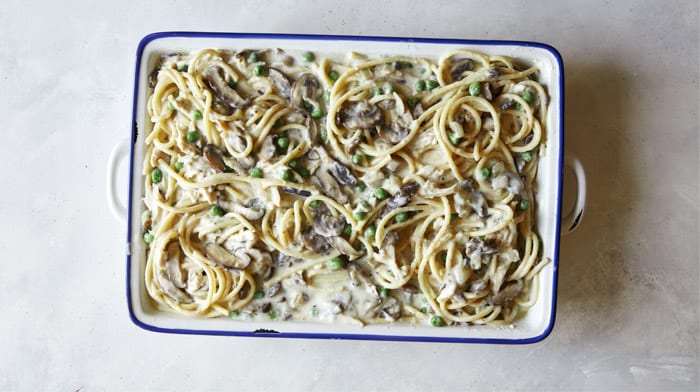 Chicken tetrazzini in a baking dish ready to be baked.