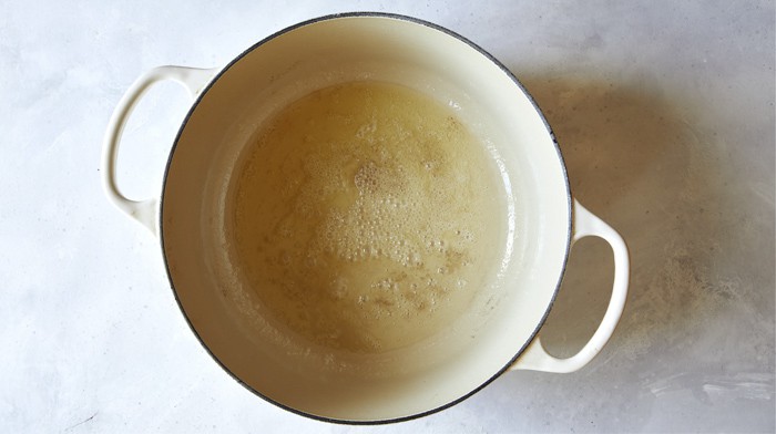 Melted butter in a stock pot.