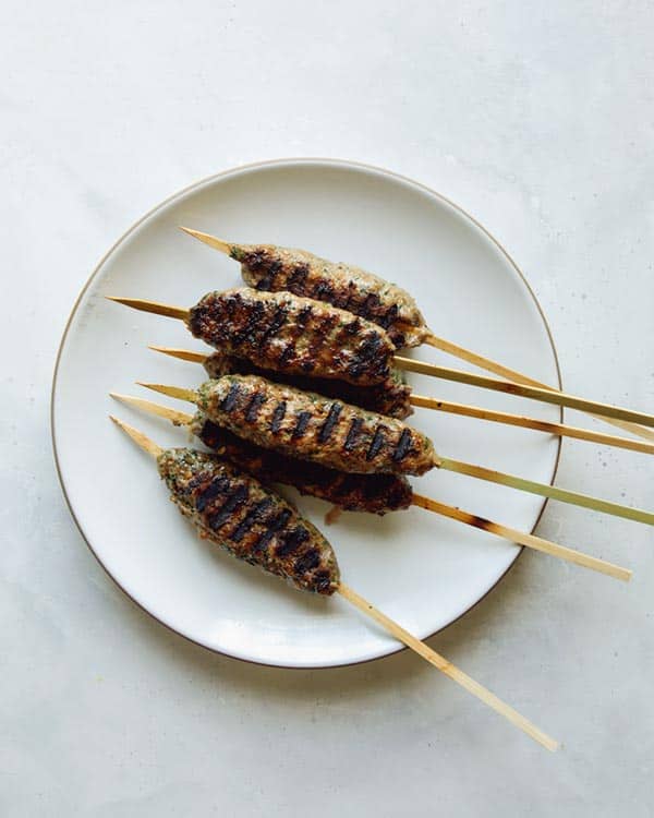 Lamb kofta freshly grilled on a plate.