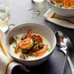 Two bowls filled with shrimp and grits recipe.