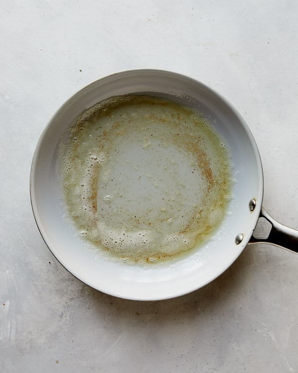 Melted butter in a skillet.