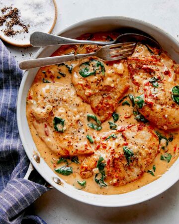 Tuscan chicken recipe in a skillet ready to be served.