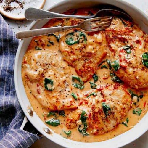 Tuscan chicken recipe in a skillet ready to be served.