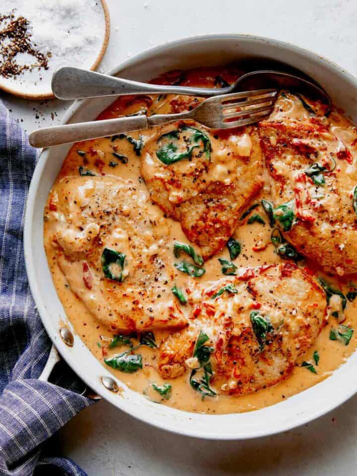 Tuscan chicken recipe in a skillet ready to be served.