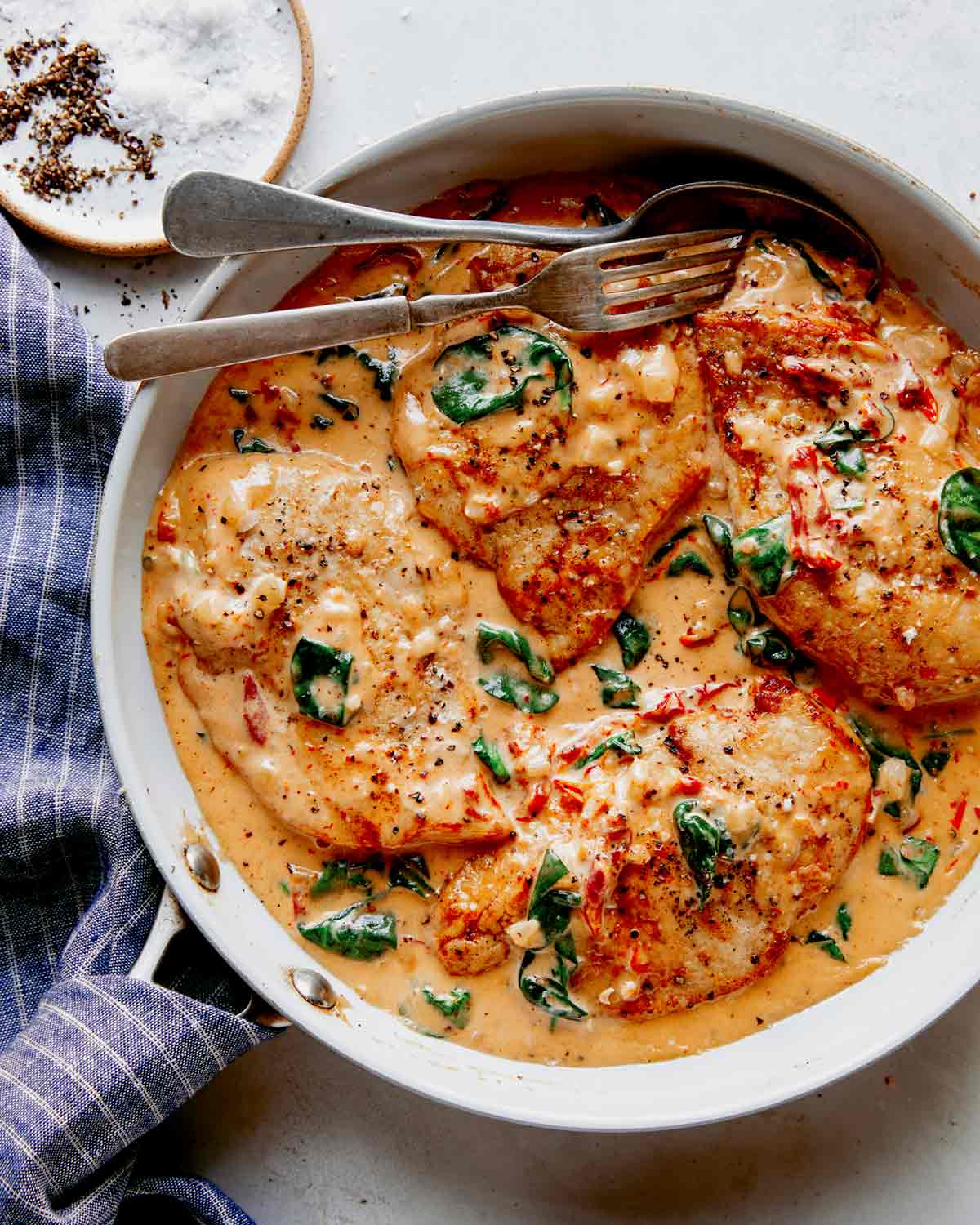 Tuscan chicken recipe in a skillet ready to be served. 