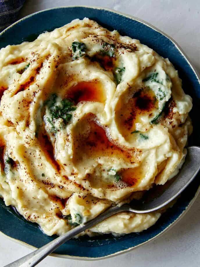 Brown Butter Colcannon recipe in a bowl with a spoon in it.