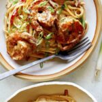 Overhead image of two bowls of cajun shrimp pasta.