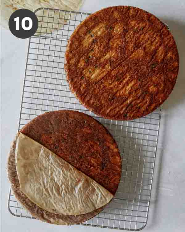 Carrot cake layers on a cooling rack.