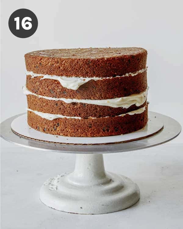 Carrot cake with frosting in between the layers.