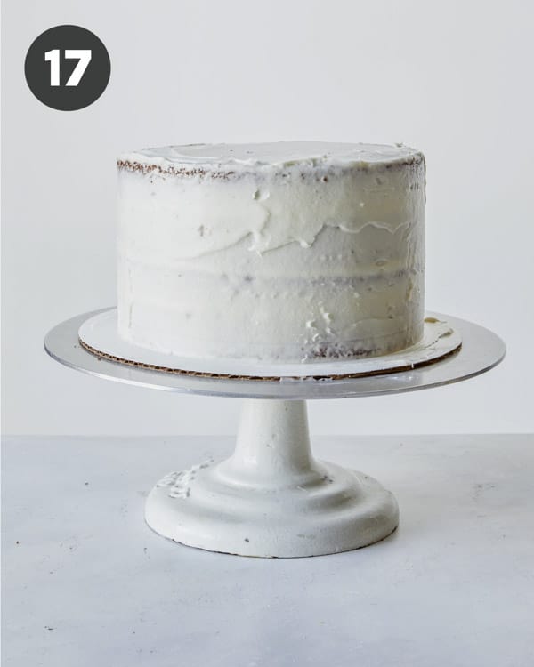 A carrot cake recipe with a crumb coat on it.