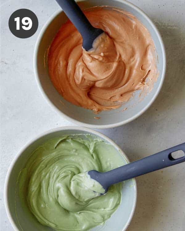 Two bowls of frosting, orange and green.