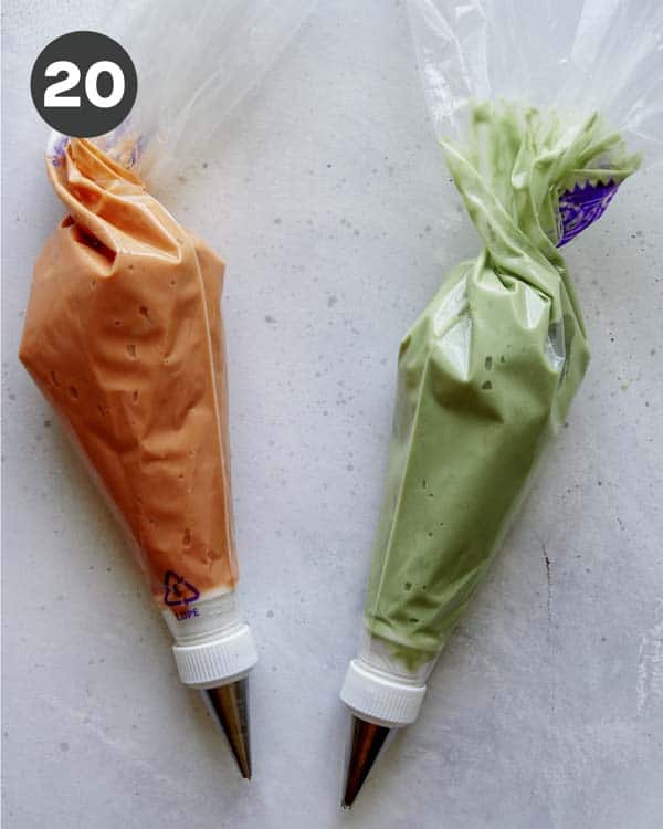 Frosting bags with orange and green frosting.