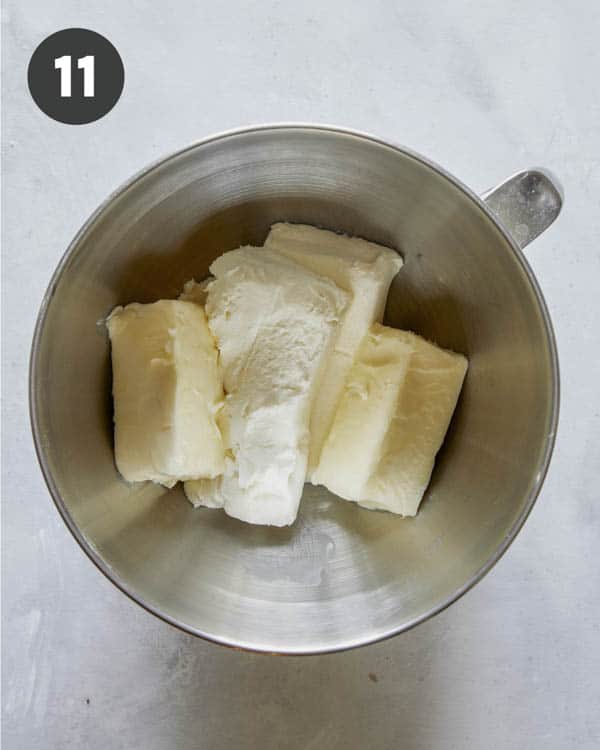 Ingredients for cream cheese frosting in a bowl.