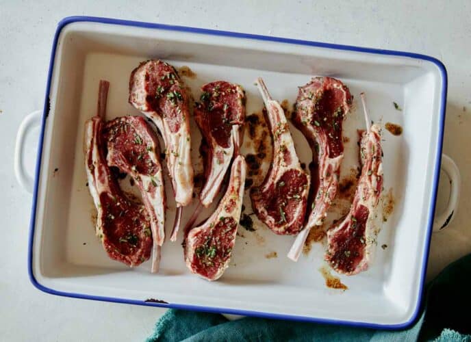 Garlic Butter Lamb Chop in a baking dish marinating.