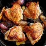 Crispy chicken thigh recipe in a skillet.