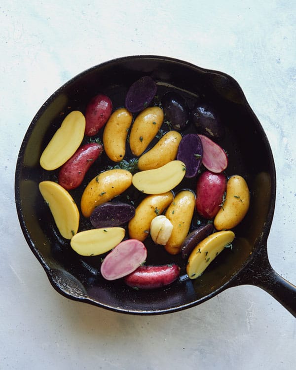 Fingerling potatoes in a skillet.