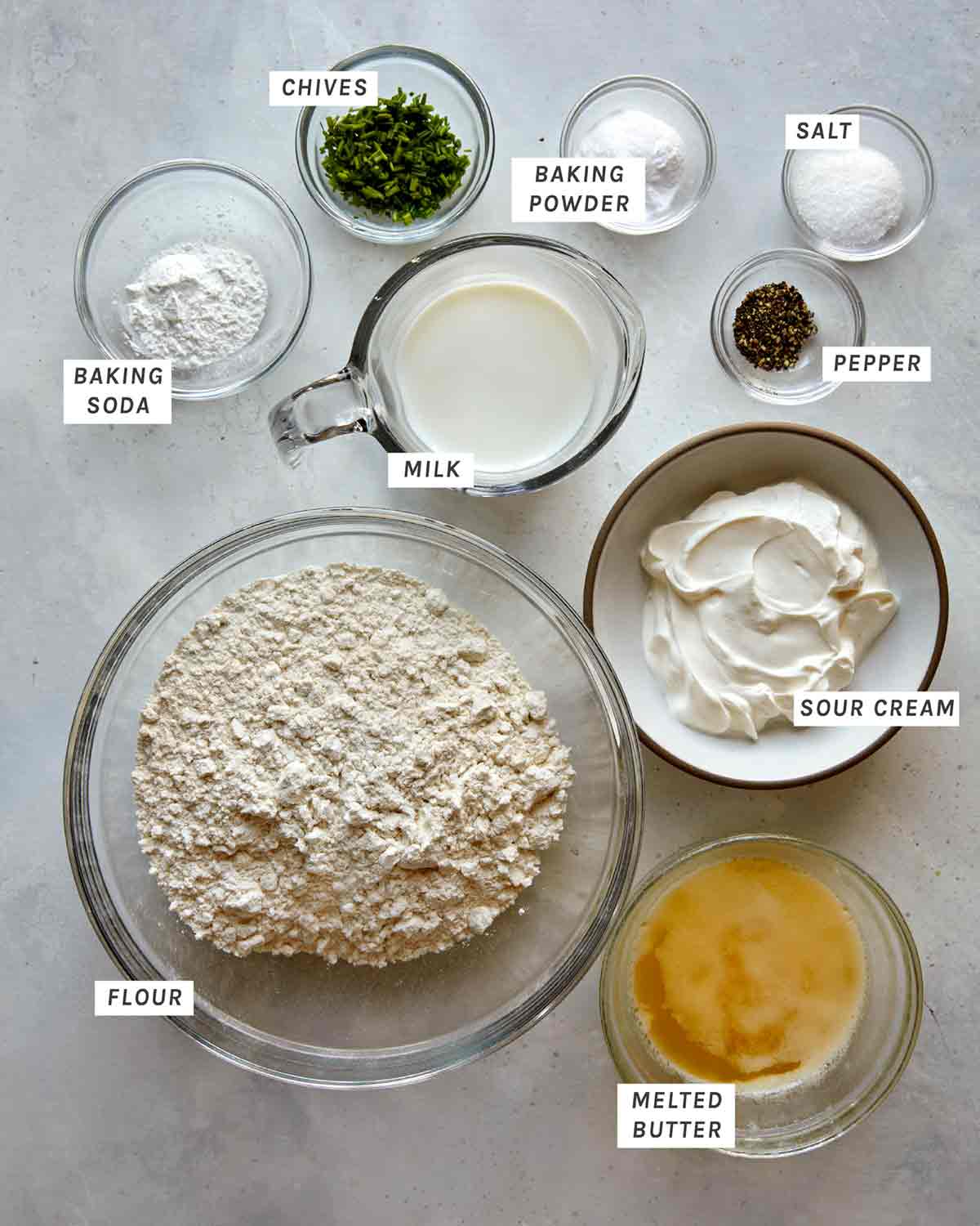 Ingredients for sour cream and chive drop biscuit recipe on a counter. 