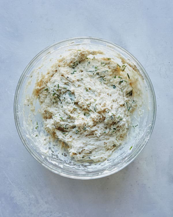 Drop biscuit dough in a bowl ready to be scooped.