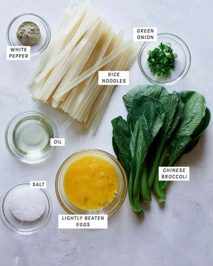 Pad see ew ingredients laid out on a kitchen counter.
