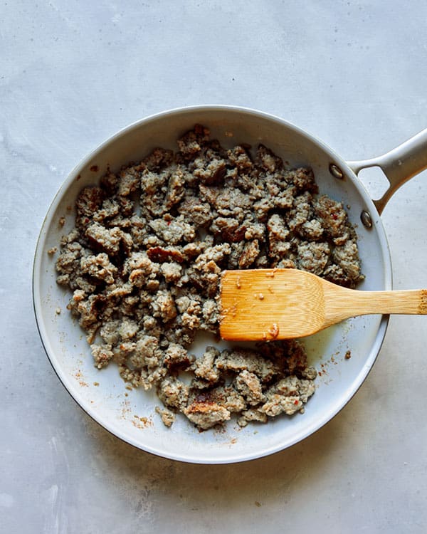 Cooking breakfast sausage in a skillet.