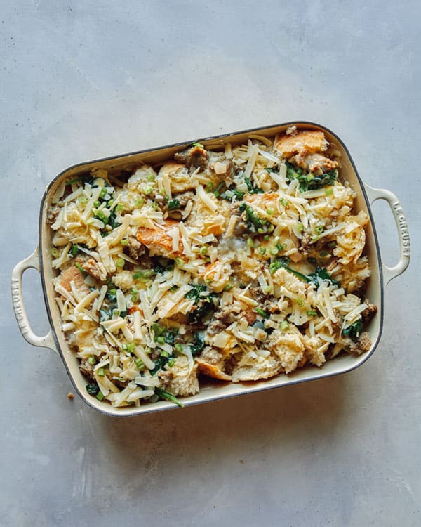 A completed sausage strata recipe in a baking dish ready to be baked.