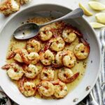 Close up on a skillet of Shrimp Scampi.