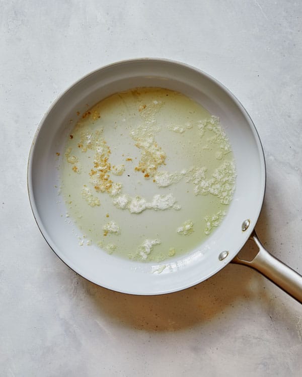 Butter melting in a skillet for shrimp scampi.