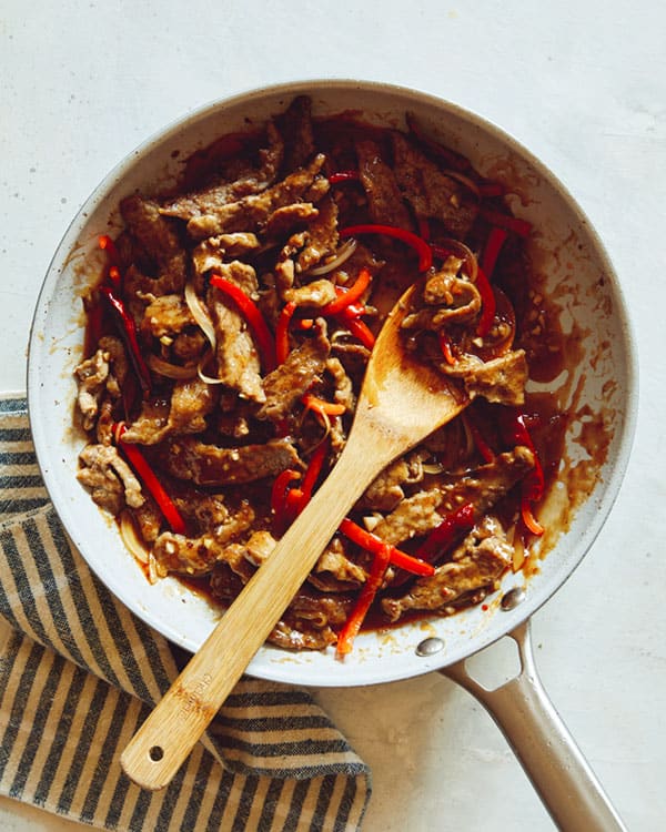 Szechuan beef in a skillet. 