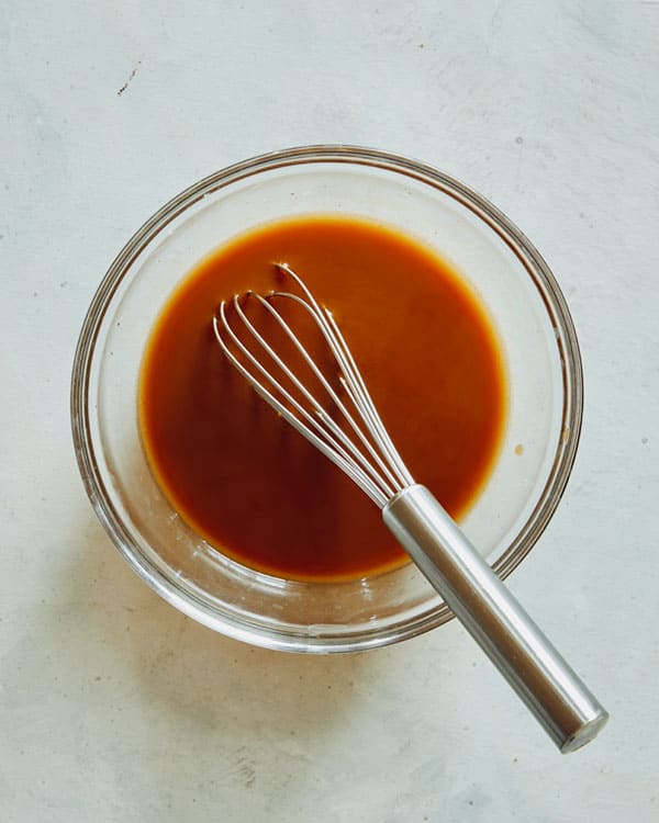 Szechuan beef sauce whisked together in a bowl.