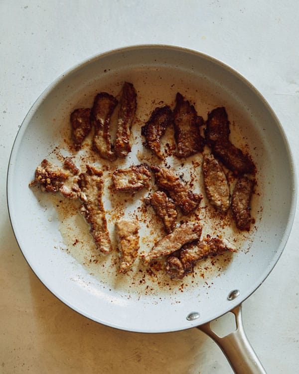 Cooking beef in a skillet. 