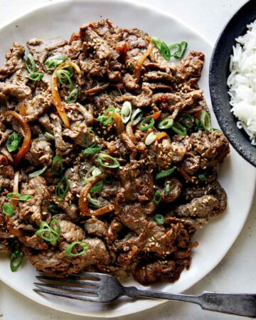 Beef bulgogi recipe on a plate with rice.