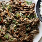 Beef bulgogi recipe on a plate with rice.