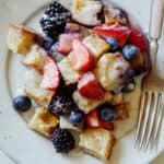 Triple berry bread pudding recipe on a plate.