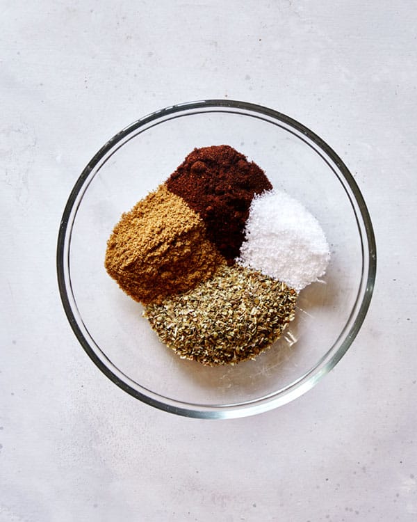 Carnitas spices in a glass bowl.