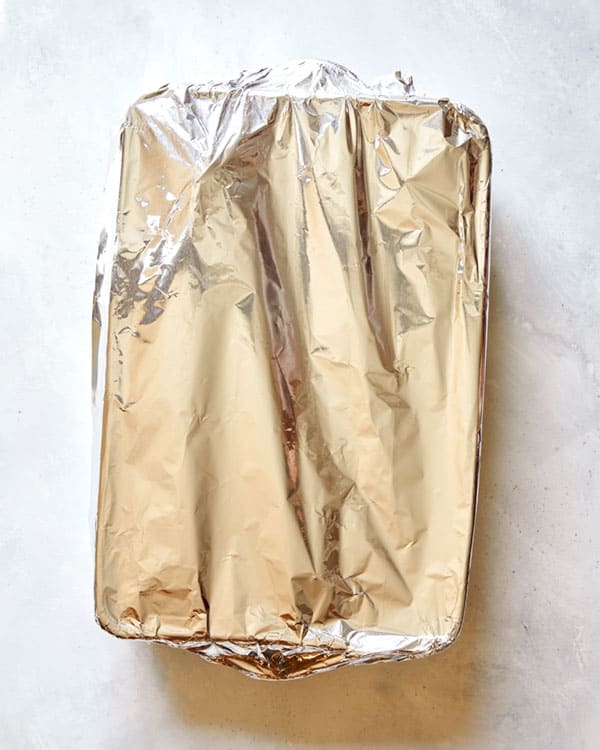 Carnitas covered with foil.