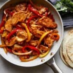 Chicken fajitas recipe in a skillet.