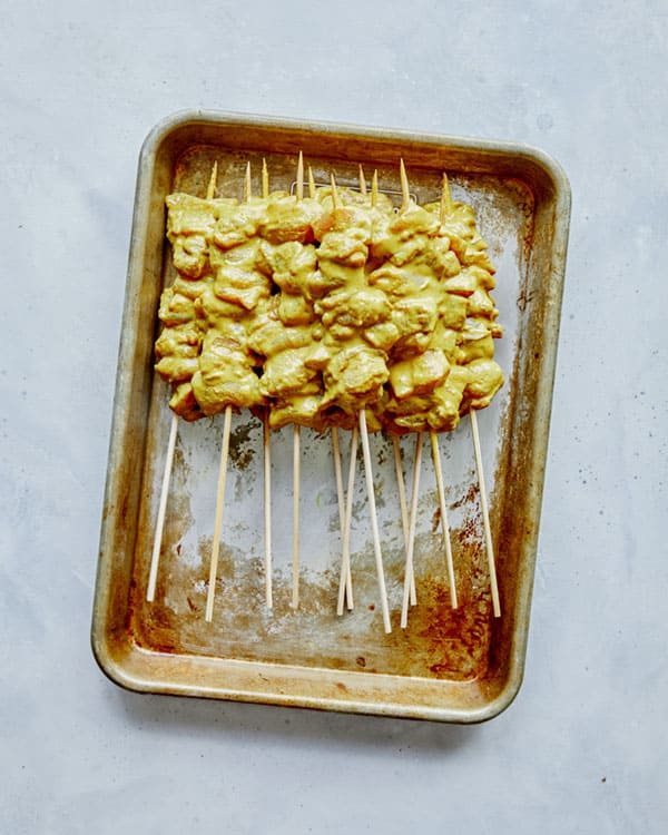 Chicken satay ready to be grilled.