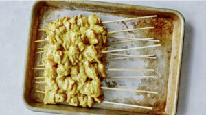 Chicken satay ready to be grilled.