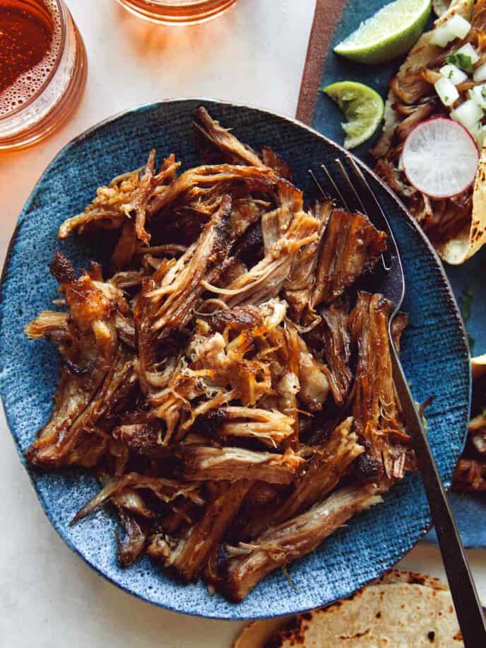 Carnitas recipe in a bowl being served. 