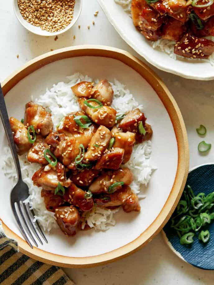 Honey garlic chicken dinner recipe in two bowls ready to be eaten. 