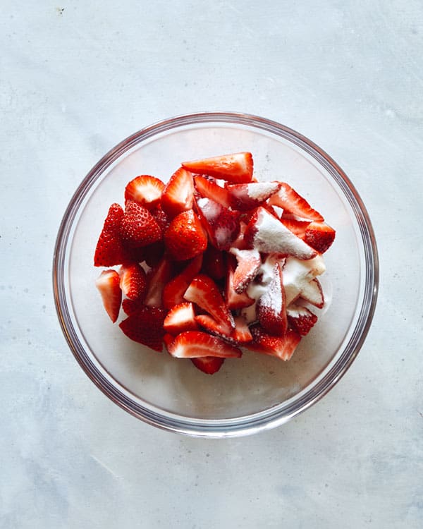 Strawberry ingredients for strawberry shortcake in a bowl.