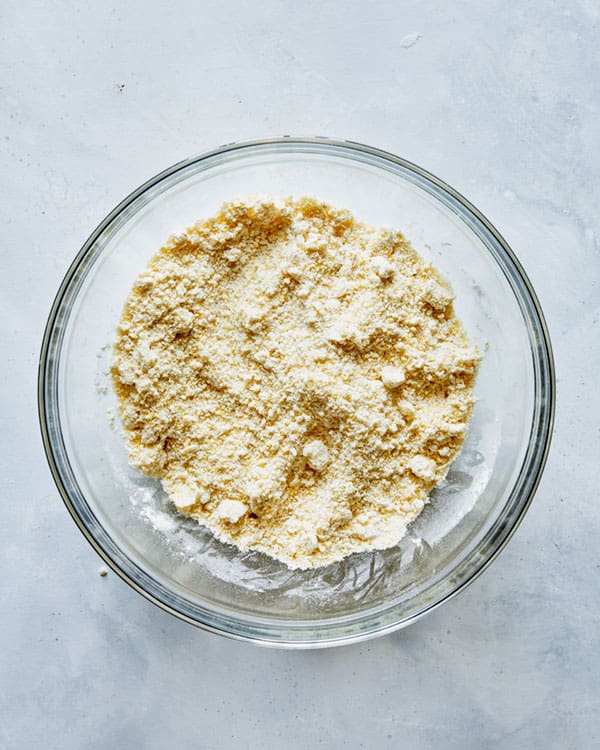 Biscuit ingredients for strawberry shortcake mixed together in a bowl.
