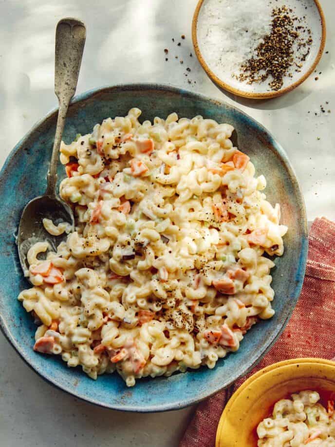 Hawaiian style macaroni salad in a bowl with some served.